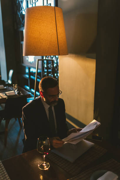 istock Mature Businessman Working in High-End Restaurant 881839050