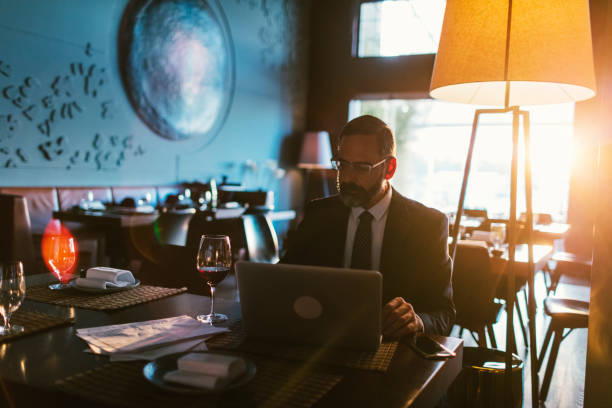 istock Mature Businessman Working in High-End Restaurant 881839076