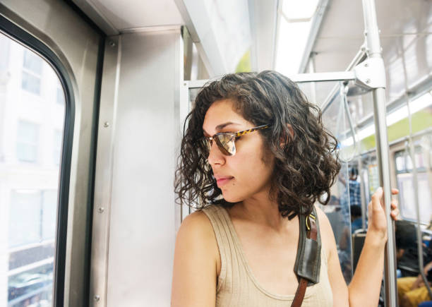 istock Beautiful Hispanic Woman Commuting to Downtown Chicago on Elevated Train 881842578