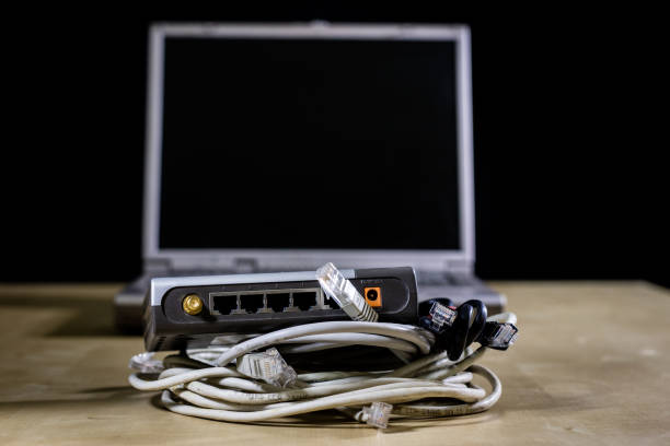 istock Network hub and rj45 cables on the stage. Computer accessories used in networking. 881849694