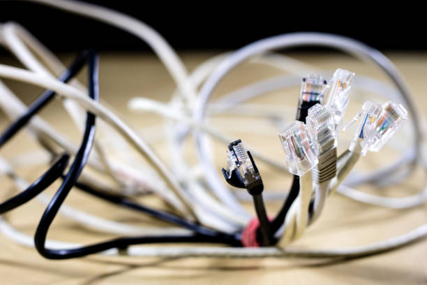 istock Rj45 cords on the stage. Computer accessories used in network connections. 881855906