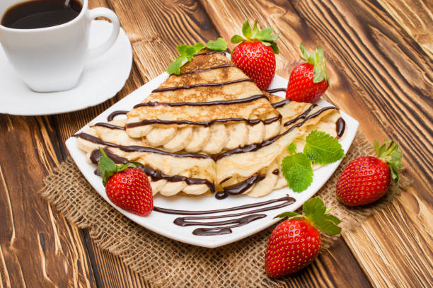istock Crepes with Banana and strawberries 881865926