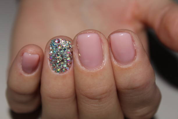 istock Manicured nails with pink nail polish. 881876842