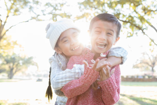 istock Playful brother and sister 881877018