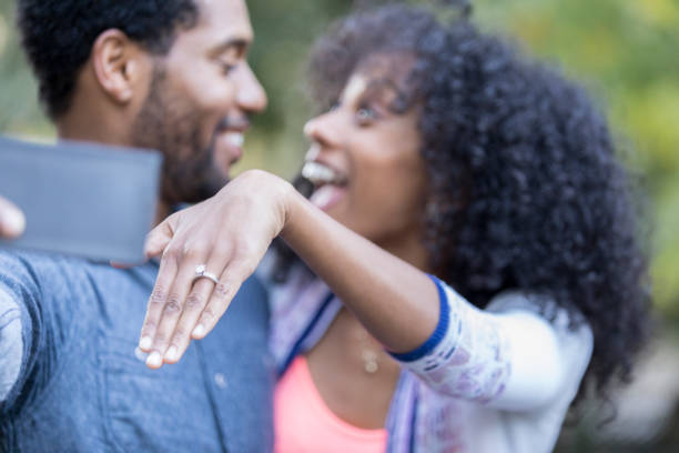 istock Excited newly engaged couple take selfie 881881700