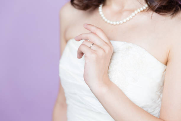 istock attractive asian woman wedding image on purple background 881882074