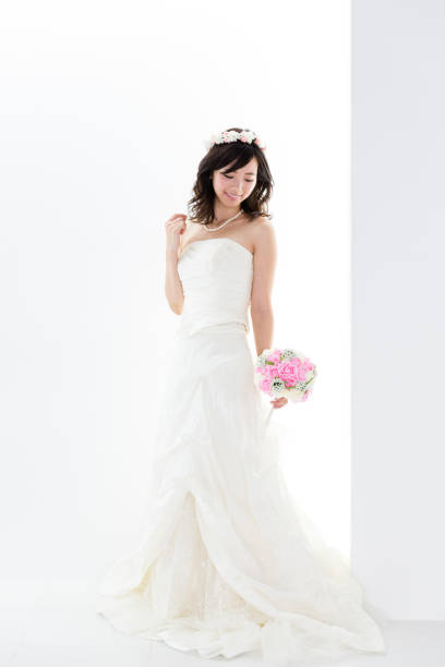 istock attractive asian woman wedding image on white background 881882326
