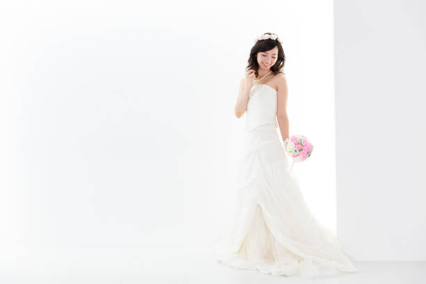 istock attractive asian woman wedding image on white background 881882330