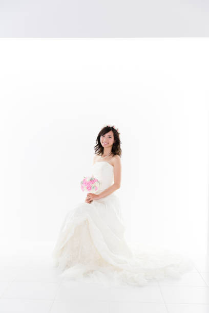 istock attractive asian woman wedding image on white background 881882340