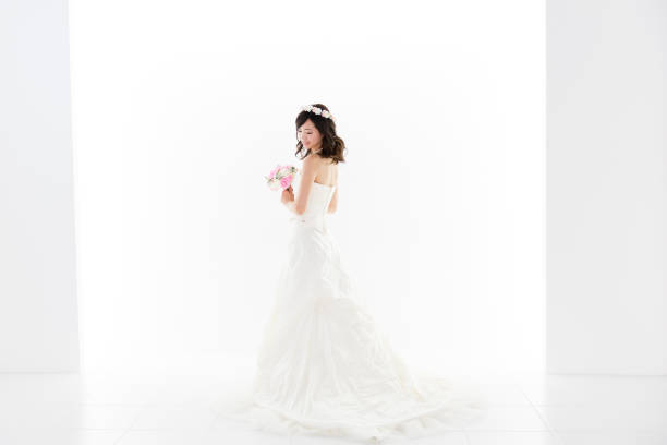 istock attractive asian woman wedding image on white background 881882344