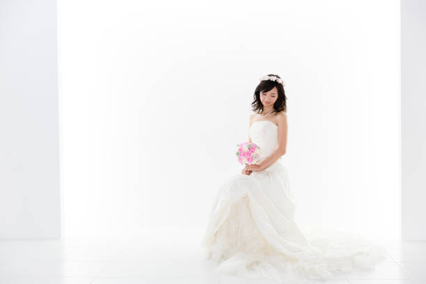 istock attractive asian woman wedding image on white background 881882356