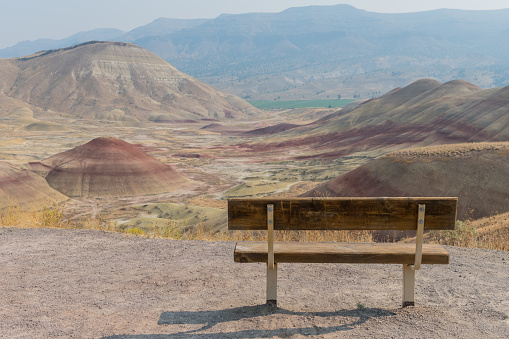 Empty Park Bench in Painted Hills with Copy Space to left