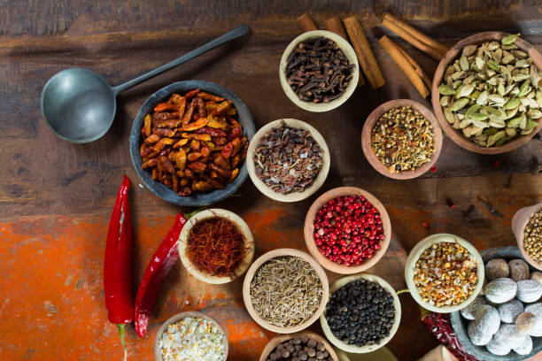 Variety of different asian and middle east spices, colorful assortment, on old wooden table Variety of different asian and middle east spices, colorful assortment, on old wooden table, close up Cardamom stock pictures, royalty-free photos & images