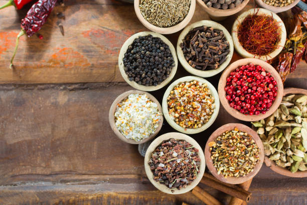 Variety of different asian and middle east spices, colorful assortment, on old wooden table Variety of different asian and middle east spices, colorful assortment, on old wooden table, close up Cardamom stock pictures, royalty-free photos & images