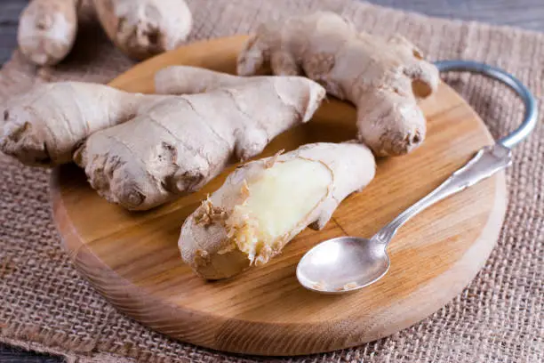 Peeled ginger root with spoon