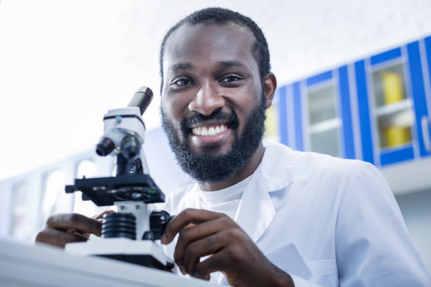 istock Joyful nice scientist smiling to you 881892918