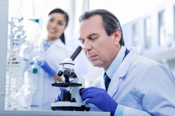 istock Serious adult man focusing on his work 881900534