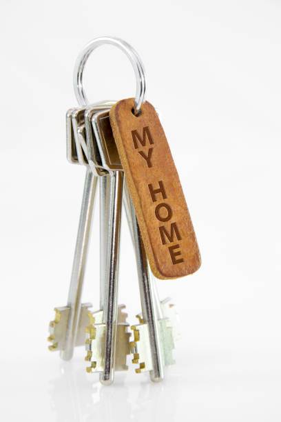 istock Leather key chain with keys on isolated white background. My home 881900954