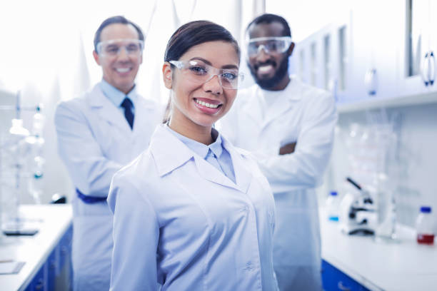 istock Nice young woman standing with her team 881903834