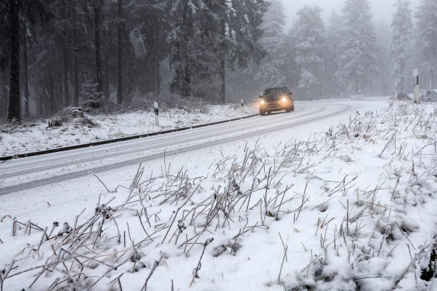 istock Snow covered road - winter driving conditions 881903974