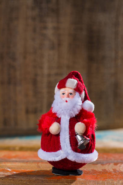 istock Christmas decoration, red Santa Claus with silver bell 881912262