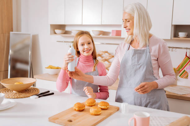 istock Joyful elderly woman taking a bottle 881914658
