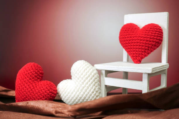 istock Red heart on white chair with brown background 881924126