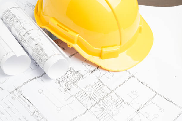 istock office desk with helmet on white background 881931628