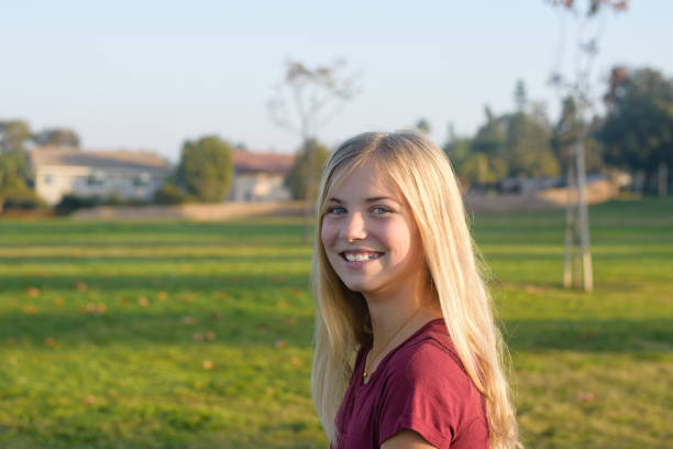 istock Young female smiles on way to school 881931958