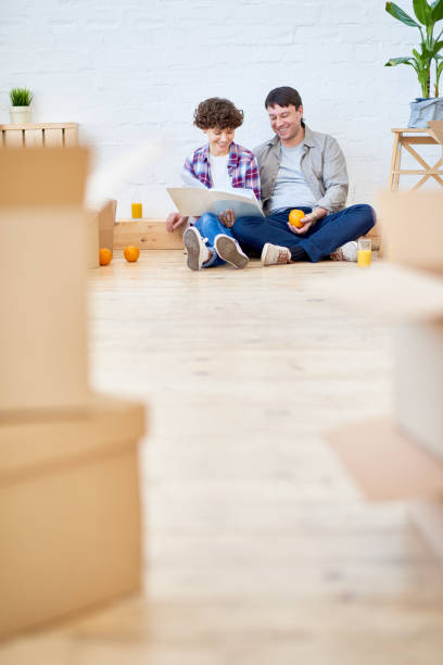 istock Jolly couple enjoying life after moving 881938780