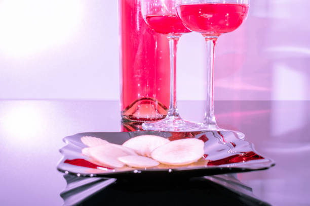 Glasses of rose wine and apples as snacks
