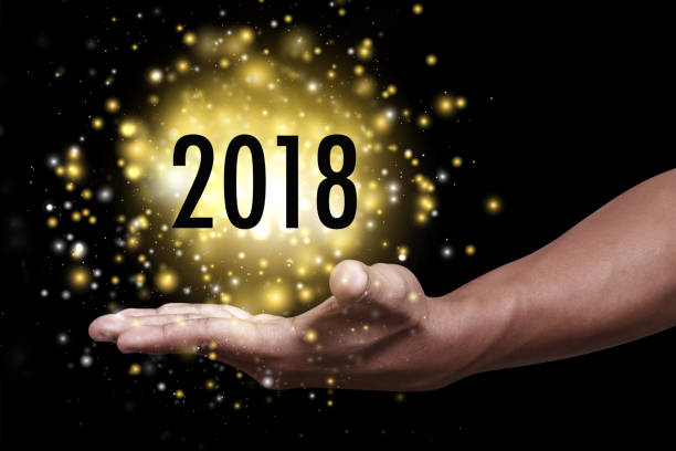 istock Hand showing new year 2018. 881949822