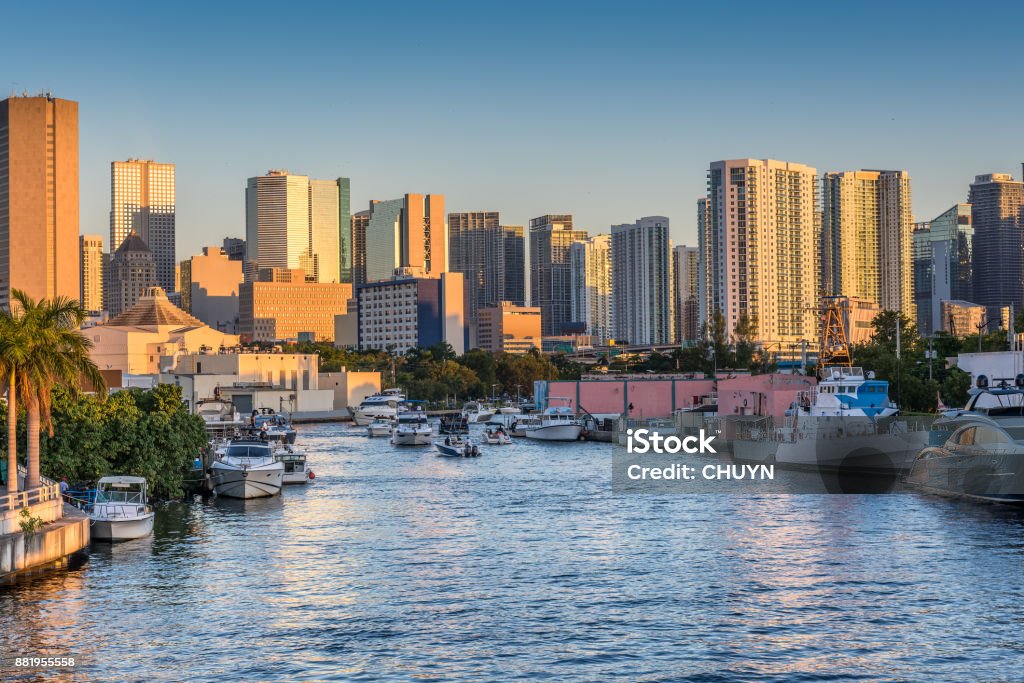 Miami river sunset Intense maritime traffic over Miami river close to downtown. Miami Stock Photo