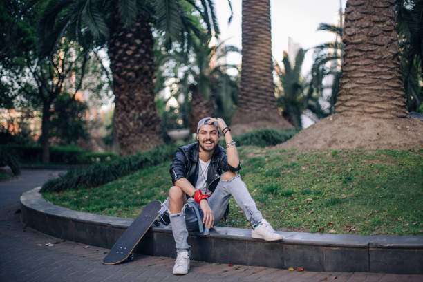 istock Skater sitting outdoors 881955846