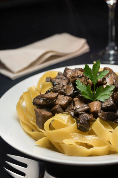 istock Pasta with porcini mushrooms 881956344