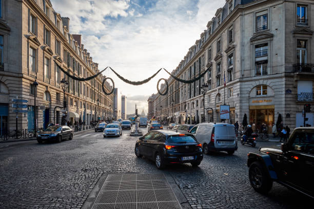 Paris, France - November 23, 2017: Traffic  at sunset on Rue Royal, Paris France