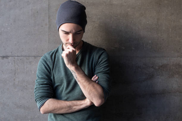 istock Portrait of a young man while thinking 881965054