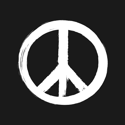 Peace sign painted brush. White hippie symbol isolated on black background. Grunge.