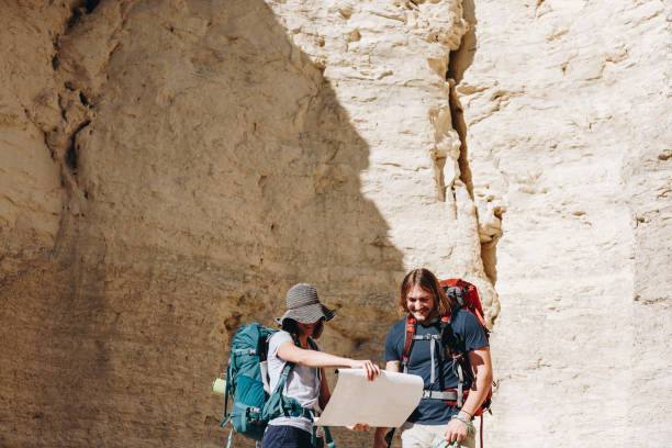 istock Couple hiking together in the wilderness 881977422