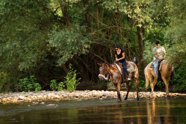 istock Couple riding horses in Italy 881984158