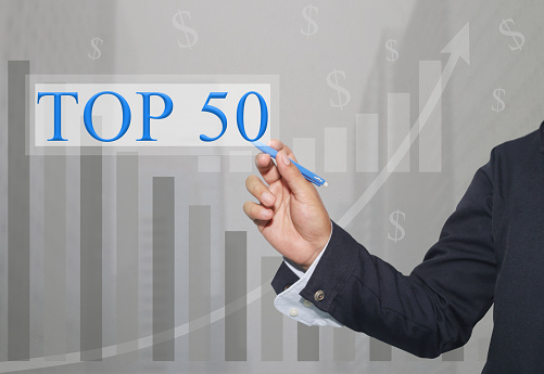 Hand of businessman Write a text of TOP50 in concept of presenting ideas in your business.