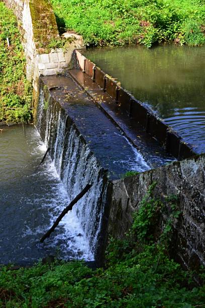 istock City stream shallow dam during summer season 882021970