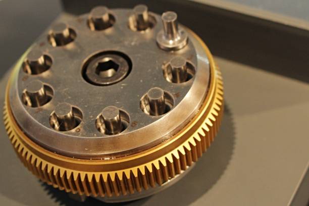 istock Tenfold multitool used in compression molding and punching machines with cog wheel around the diameter displayed on industrial and machinery expo 882024946