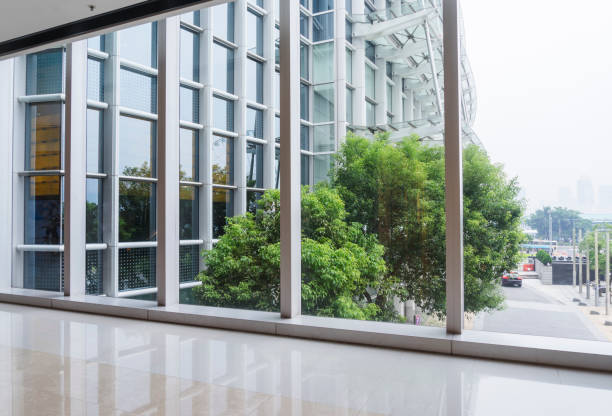 istock modern glass wall of office building 882025036
