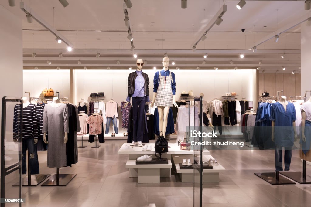 interior of modern fashion shop beautiful clothes in modern fashion shop Store Stock Photo