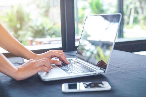 istock Woman hand working with a laptop computer in the office. 882063922