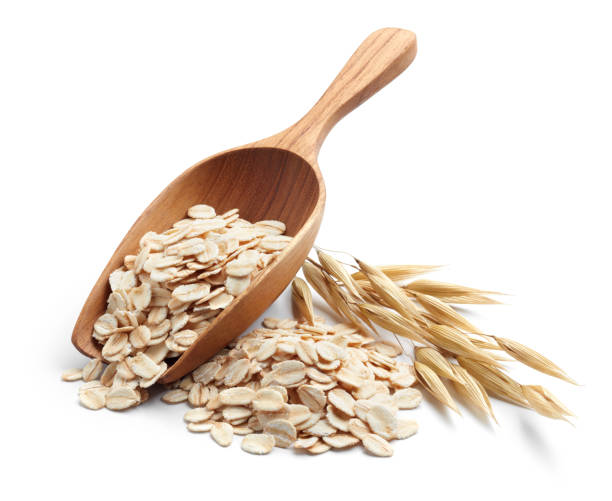 rolled oat scoop and pile of oatmeal with its plant oat crop photos stock pictures, royalty-free photos & images