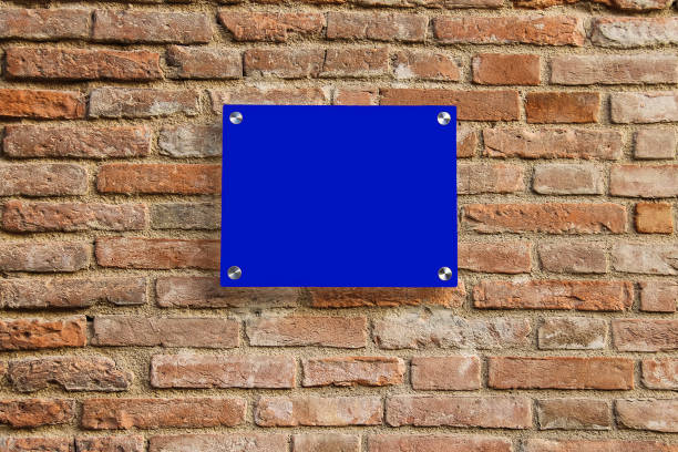 istock Empty information sign on old brick wall. Blue color 882091324