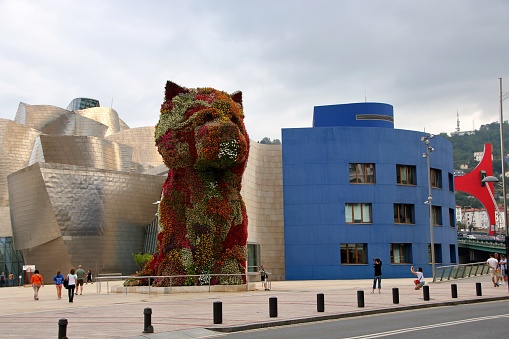 At Bilbao  - Spain - On 08/30/2017 - Puppy by Jeff Koons the huge sculpture made of flowers  at the entrance of Guggenheim museum at Bilbao, Spain,