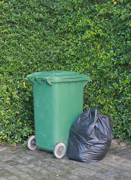 istock Plastic trash bags and rubbish bin in a park. 882101484